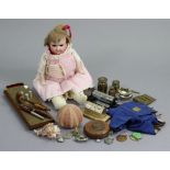 A bisque head girl doll, 19” tall, dressed, w.a.f.; a brass-mounted cribbage board; two perpetual