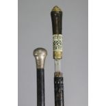 An Indian swordstick with bone carved handle & ebonised sheath, 35¾” long; & an ebonised wooden