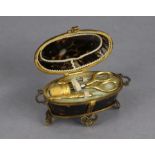 A 19th century French tortoiseshell & gilt-ormolu etui of oval form, having hinged lift-lid