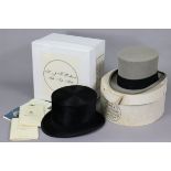 A Tress & Co. of London black silk top hat; & a Lock & Co. of London grey felt top hat, each with
