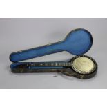 A late 19th/early 20th century rosewood six-string banjo, 36” long (lacking strings & bridge),