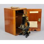 A VINTAGE BLACK LACQUERED “SERVICE” MONOCULAR MICROSCOPE BY W. WATSON & SONS OF LONDON (No. 66477)