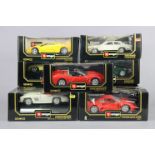 Nine Burago large scale die-cast model motor cars, each with window box.