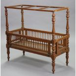 A 19th century hardwood model cot with turned supports & feet, bears plaque “Made At The Boys