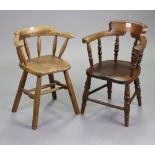 Two Windsor-style child’s spindle back elbow chairs, each with hard set, & on turned legs with