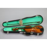 A child’s violin & bow (violin 20” long), with case.