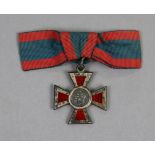 The Royal Red Cross, George V, in silver & red enamel, with ribbon.