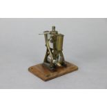 A vintage scratch-built brass & steel small steam engine mounted on wooden plinth, 4¼” high.