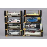 Eight Maisto large scale die-cast model motor cars, each with window box.