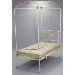 An Edwardian white painted wrought & cast-iron child’s bed of tubular design, 32¼” wide.