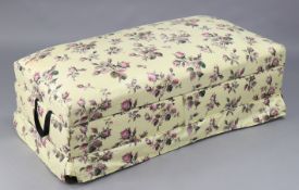 An early/mid 20th century box ottoman upholstered multi-coloured floral material, 48” wide x 15”