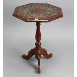 A carved walnut pedestal occasional table with octagonal top, on vase-turned centre column & three