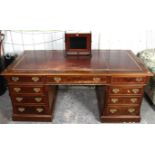A reproduction burr-walnut partner’s desk (fitted with a computer) inset gilt-tooled tan leather