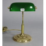 An Edwardian style brass desk lamp; two other lamps; a composition plaque; a ditto gatepost