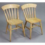 A pair of beech lath-back kitchen chairs with hard seats, & on ring-turned legs with turned
