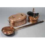 A 19th century copper oval fish kettle, 18¾” wide; a copper helmet-shaped coal scuttle, 9” high; & a