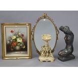 A bronzed composition nude female sculpture, 19” high; together with a gilt-frame oval wall