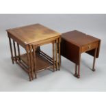 A mahogany nest of three rectangular occasional tables, each table inset tooled leather, & on