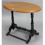 A Victorian mahogany oval occasional table on turned end supports joined by a turned centre