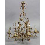 A bronzed-metal ceiling light fitting of foliate design & hung with prism drops, 23” wide x 28”