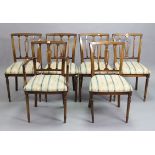 A set of six reproduction mahogany dining chairs (including one carver) with padded seats, & on
