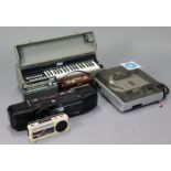 A Neostar turntable/cassette/CD player/recorder with remote, a Minnis Music portable keyboard;
