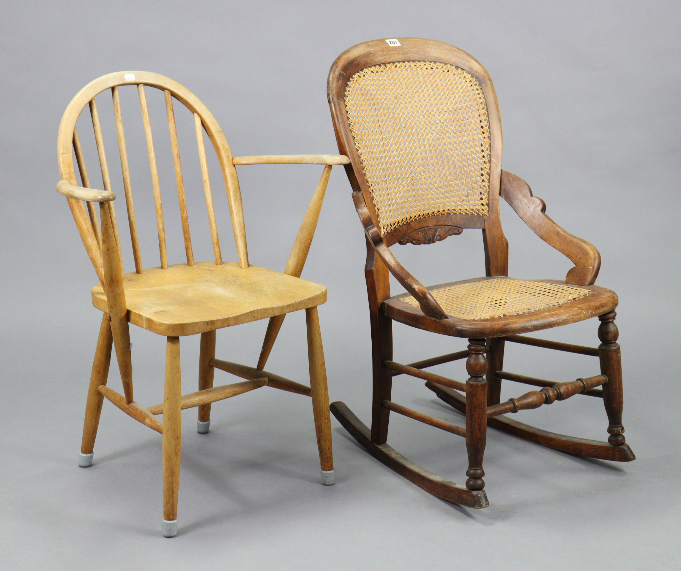 A beech-frame rocking occasional chair, inset woven-cane panel to the seat & back, & with turned