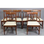 A set of six hardwood splat-back dining chairs (including a pair of carvers) with padded seats &