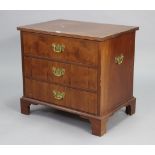A reproduction yew wood small chest fitted three long drawers with brass swing handles, & on bracket