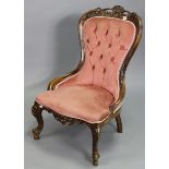 A Victorian-style nursing chair with a buttoned back & sprung seat upholstered rose pink velour, &