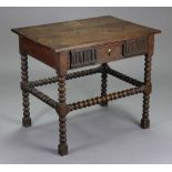A 17th century oak side table with two-board rectangular top, fitted single carved frieze drawer