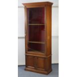 A late 19th/early 20th century mahogany narrow bookcase, converted from an “Army And Navy Makers