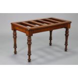A Victorian mahogany luggage stand by James Shoolbred & Co., on turned tapering legs, 28” wide x