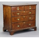 An 18th century figured walnut & feather banded chest with boxwood & ebonised stringing, fitted