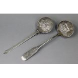 A continental white metal ladle, possibly Spanish colonial, the circular bowl embossed with