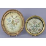 Two early 19th century silk needlework pictures, each of a floral spray, in gilt frames, 11½” x