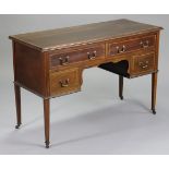 An Edwardian inlaid mahogany dressing table with moulded edge to the plain rectangular top, fitted