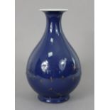 A Chinese porcelain pear-shaped vase or Yuhuchunping, with all-over blue monochrome glaze,