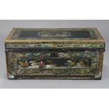 A 19th century Chinese leather-covered camphor wood trunk, with all-over painted floral & figure