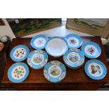 A Sevres-style dessert service, the centres painted with flowers and fruit within bleu-celeste and