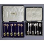 A set of six silver-gilt trophy teaspoons, each with enamel terminal depicting the Arms of the