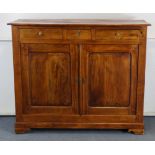 A 19th century French cabinet, possibly chestnut, with plain rectangular top, fitted three frieze
