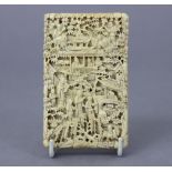 A 19th century Chinese carved ivory card case of rectangular form with all-over relief decoration of