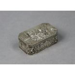 A continental silver rectangular box with canted corners, the hinged lid with repousse decoration of