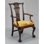 A Chippendale-style carved mahogany armchair, the pierced splat back signed with monogram to reverse