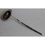 A rare 18th century punch ladle with coconut-shell oval bowl, the un-marked silver mount