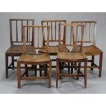 A set of five provincial oak dining chairs with open splat backs & hard saddle seats (one chair