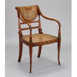 A Sheraton revival beech-frame open armchair with cane seat & back, slender scroll arms with painted