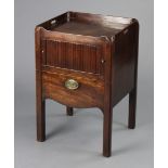 A George III figured mahogany night commode with pierced side handles to the tray-top, tambour