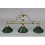 A brass three-branch overhead snooker/billiards table light fitting with green glass shades; 36” x